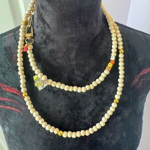 Sezane Cream Wooden Bead Layered Necklace with Charms and Gold Accents